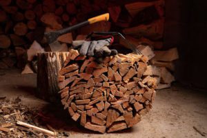 A good firewood carrier full of split logs