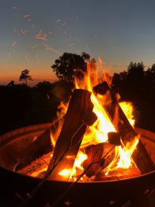 A tipi fires in a firepit