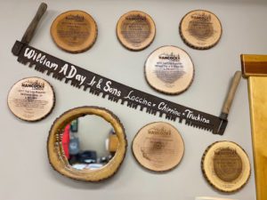 Wall of awards at Day Logging's office in Porter, Maine